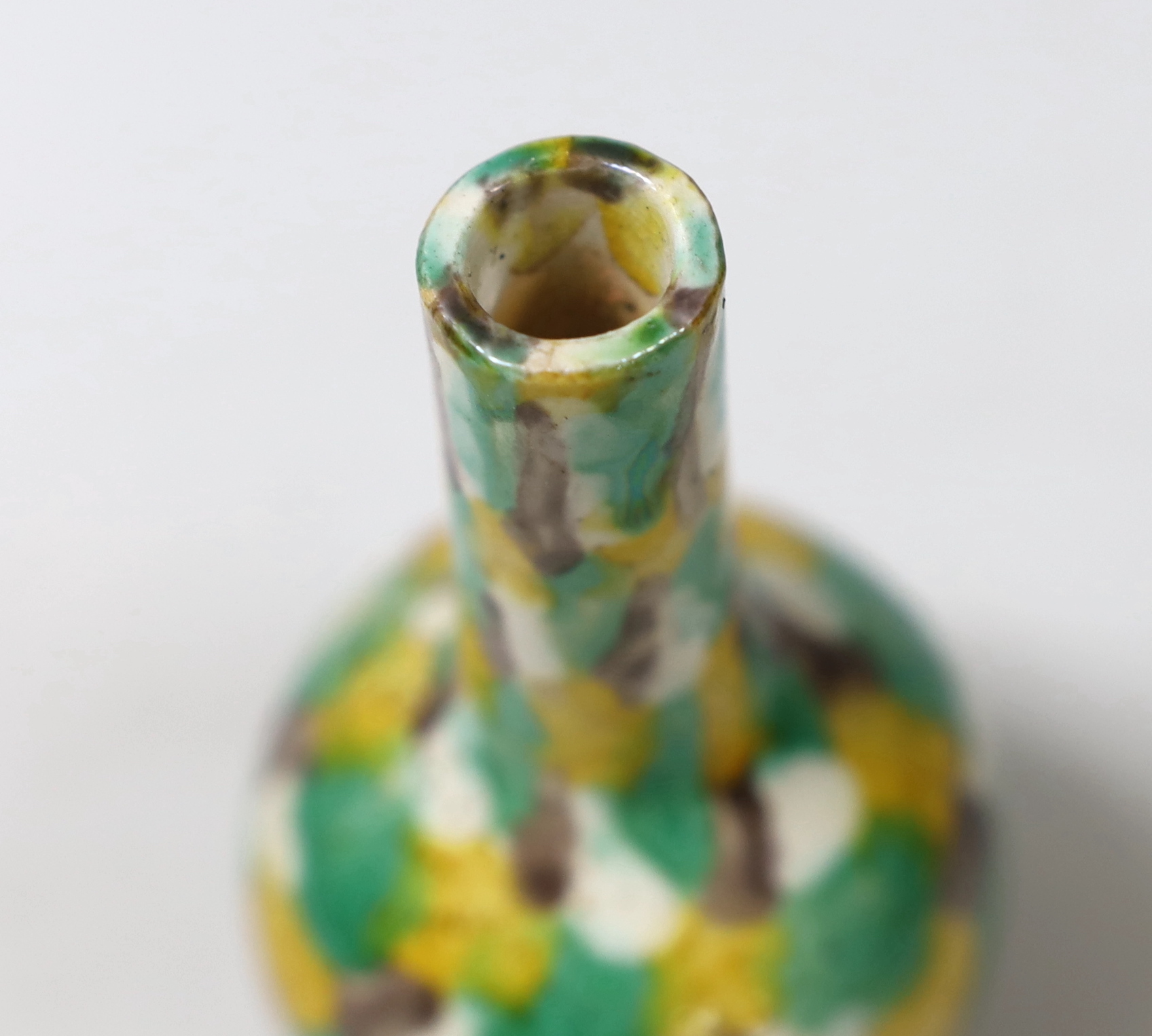 A small Chinese polychrome bottle vase, 13.5cm high